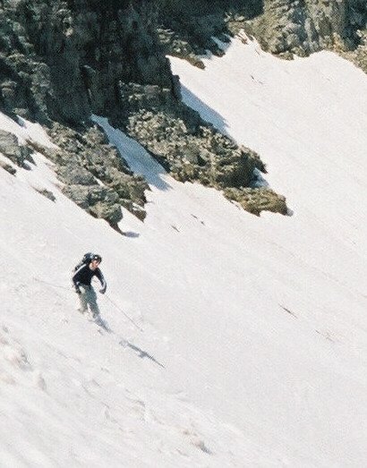 Close up of me skiing off cardiac ridge...dwarfed by the Tetons