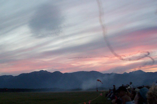 2 Planes Flying Into A Sunset