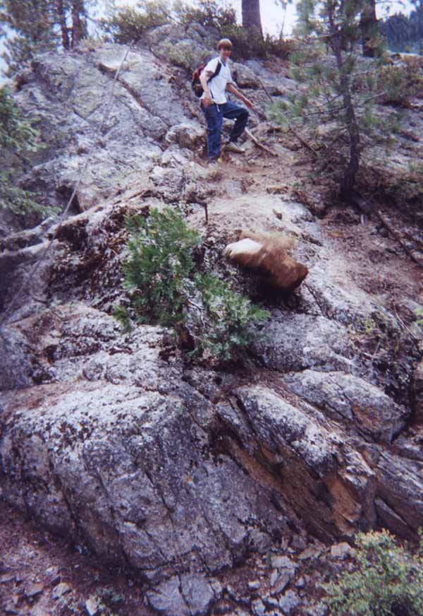 Dave rolls a big rock down hill