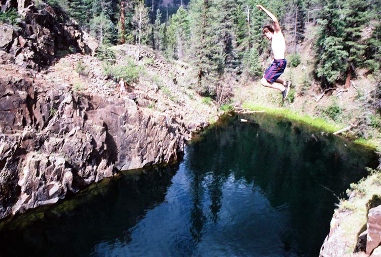 Jesse jumping off a cliff