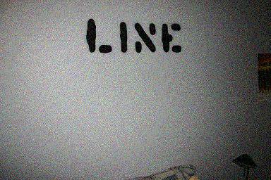 shitty quality picture of my wall and the line stencil i made