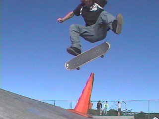 kick flip over a PYLON