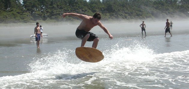 hittin a wave , skimmboarding