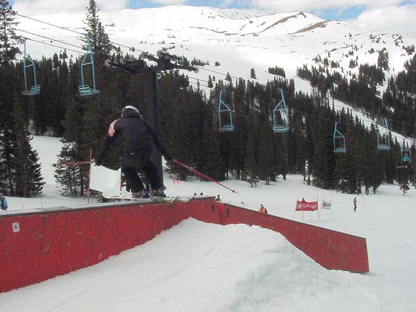 Erin (on Tele's) sliding the flat to down box in her heat of the rail jam