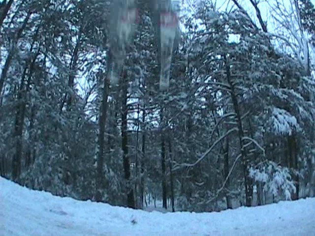 me jumping over my friend at my buddies road gap. snow was slow so i couldn't really get enough spee