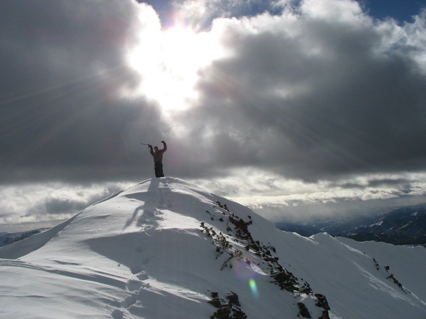 Patrick on the summit of Alex Lowe Peak