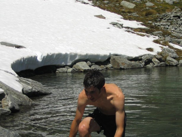 Dip in the skifield lake during summer