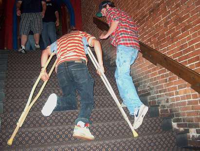 Drunk race up stairs on crutches....gonna have a bad time.
