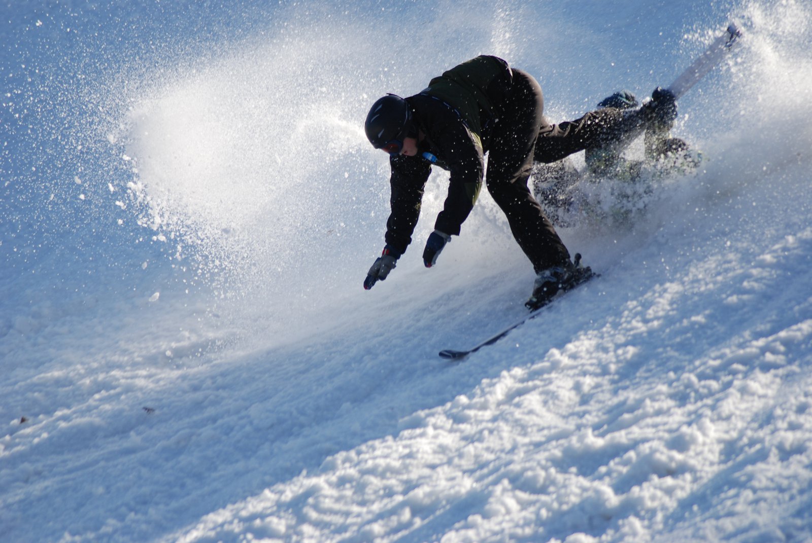 Skier and snowboarder crash