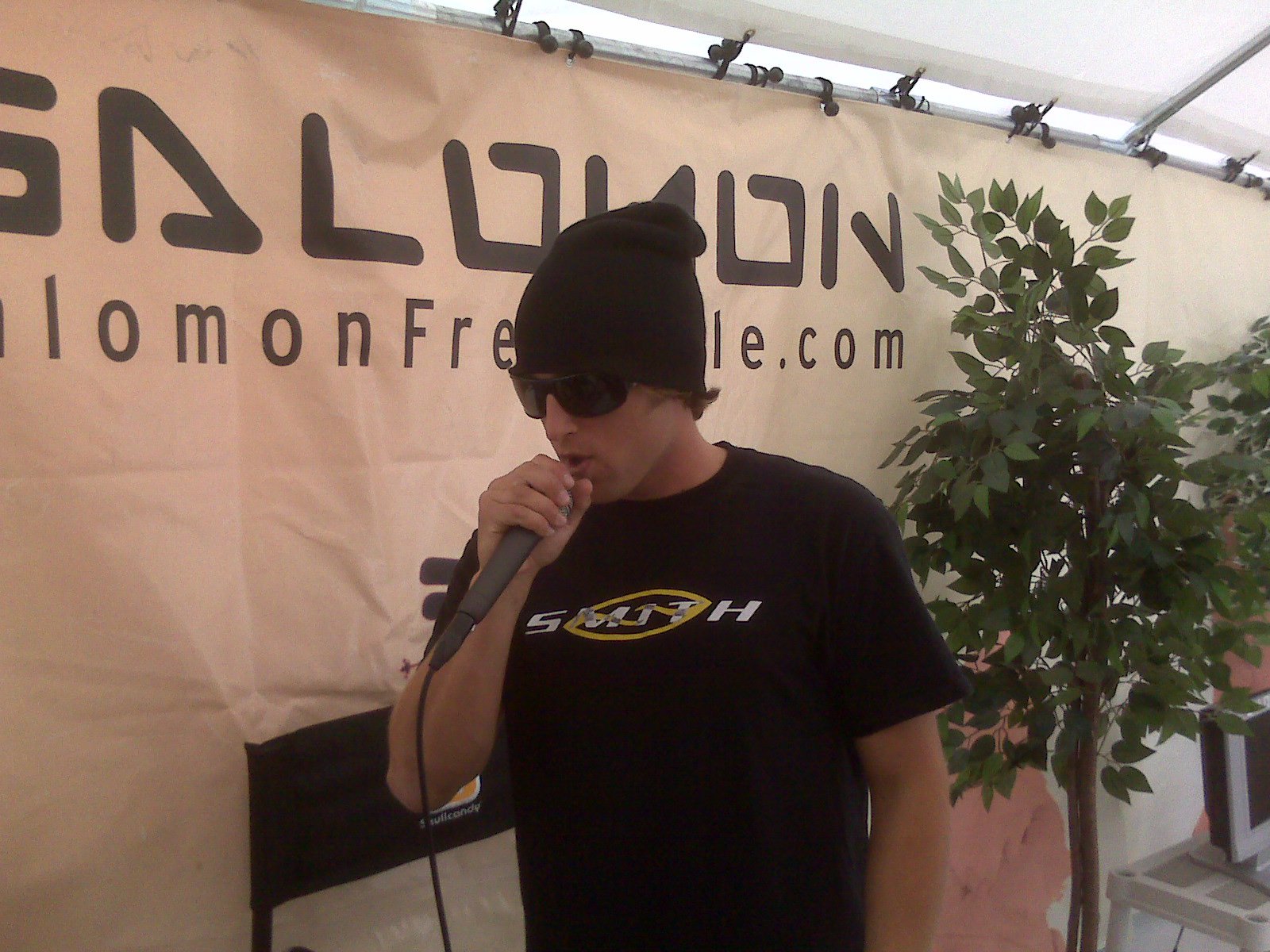 Tyler Gigg MC'ing at Momentum Ski Camp