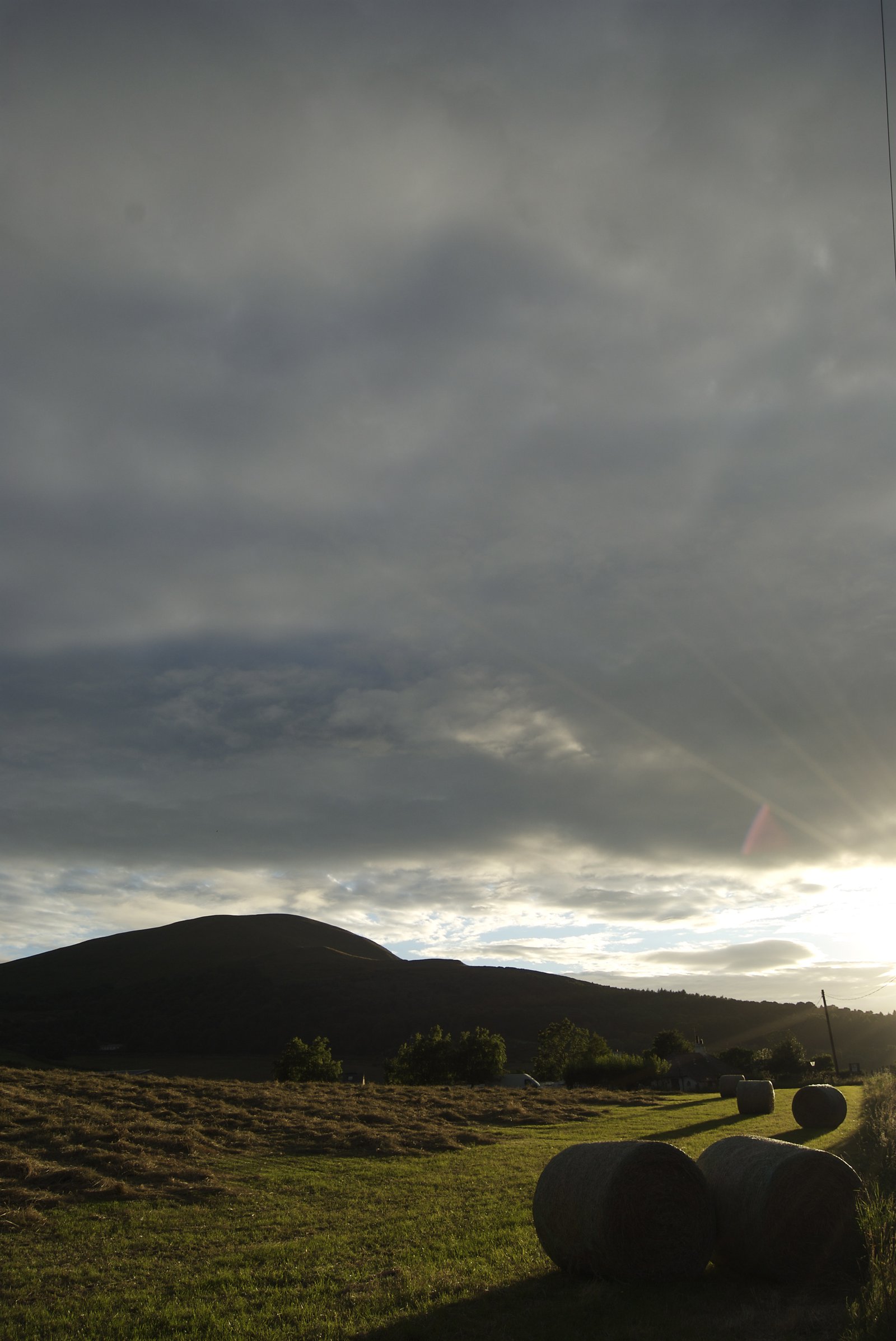 Haybails and a hill