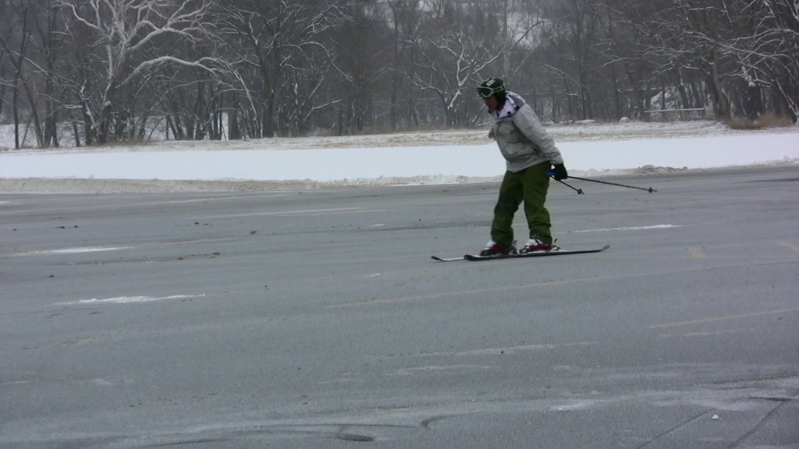 Video still: skiing in the parking lot