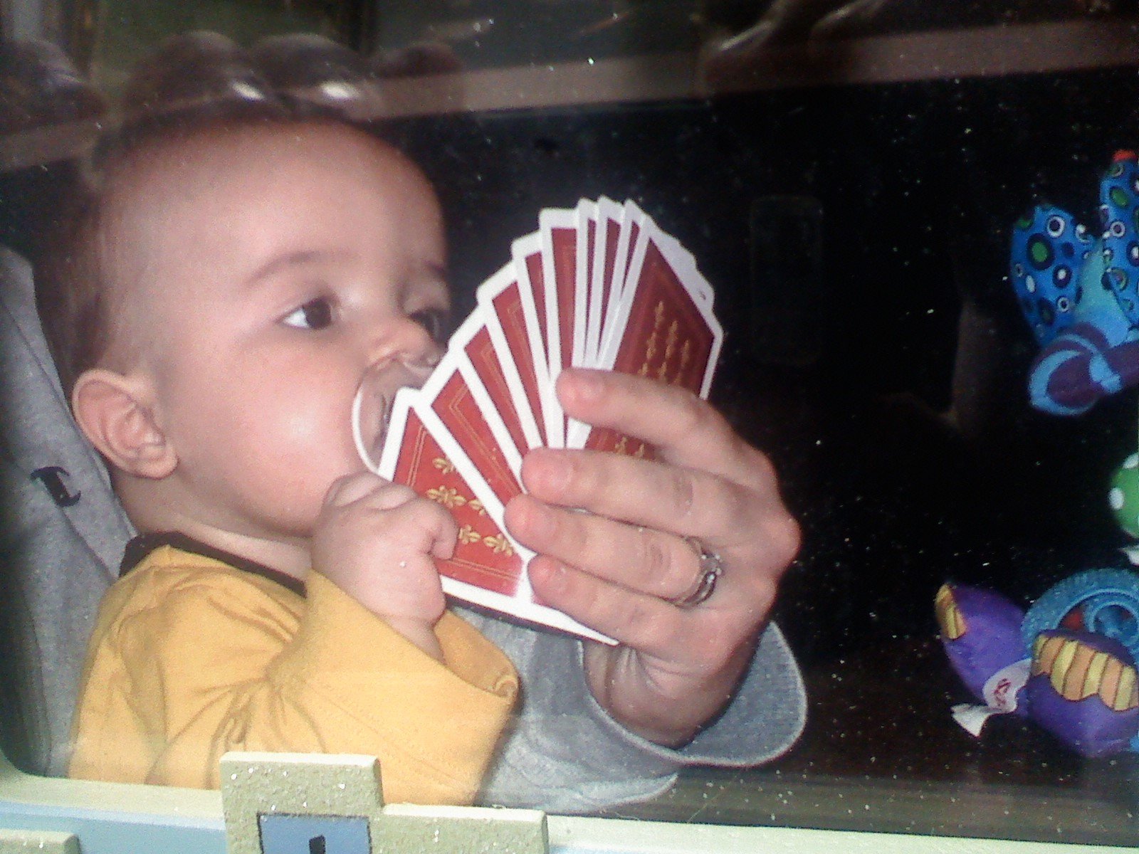 The little man already playin some cards