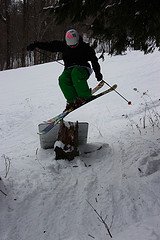 Testing friends skis on a sign?