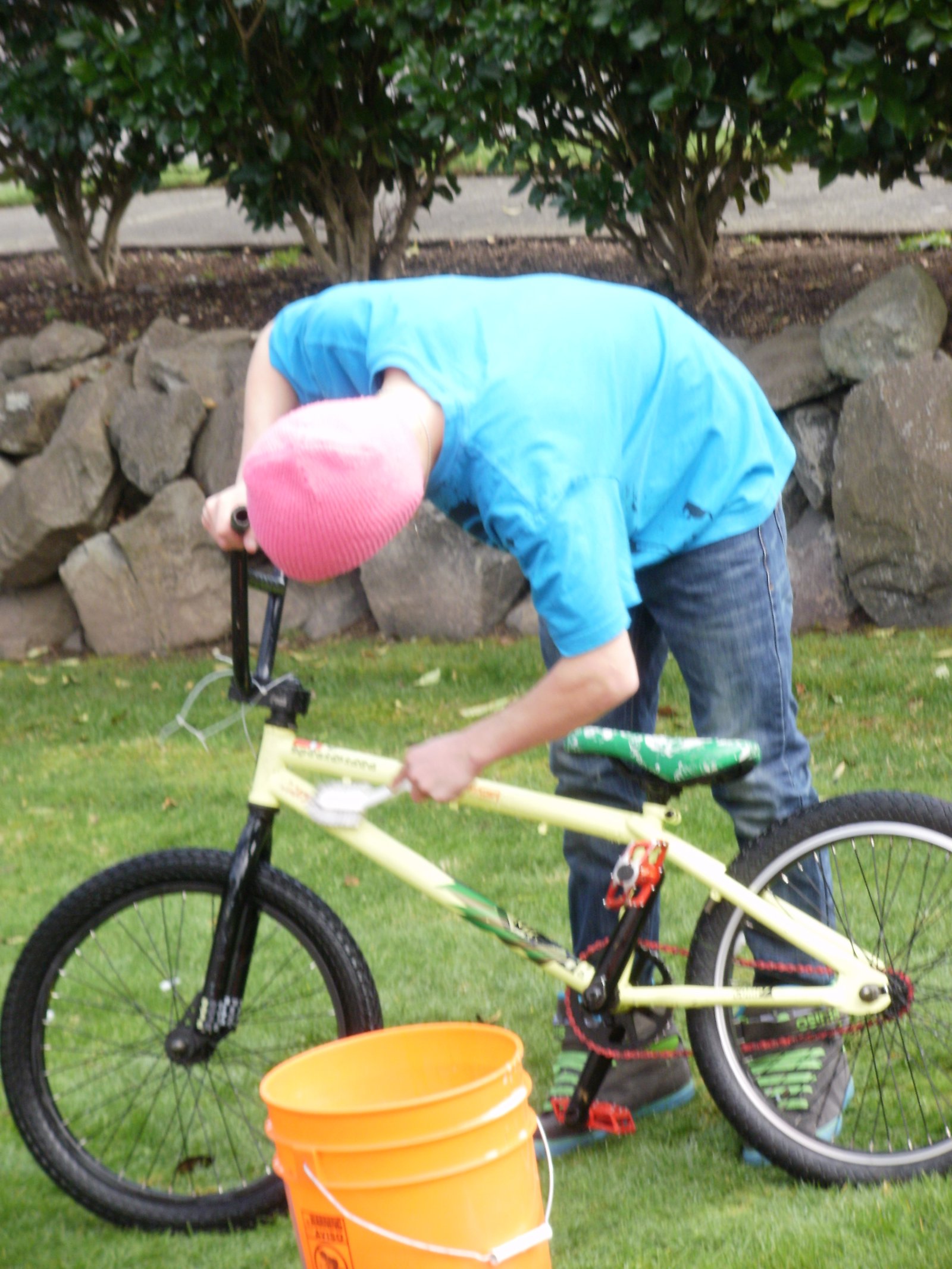 My kid washing his bike