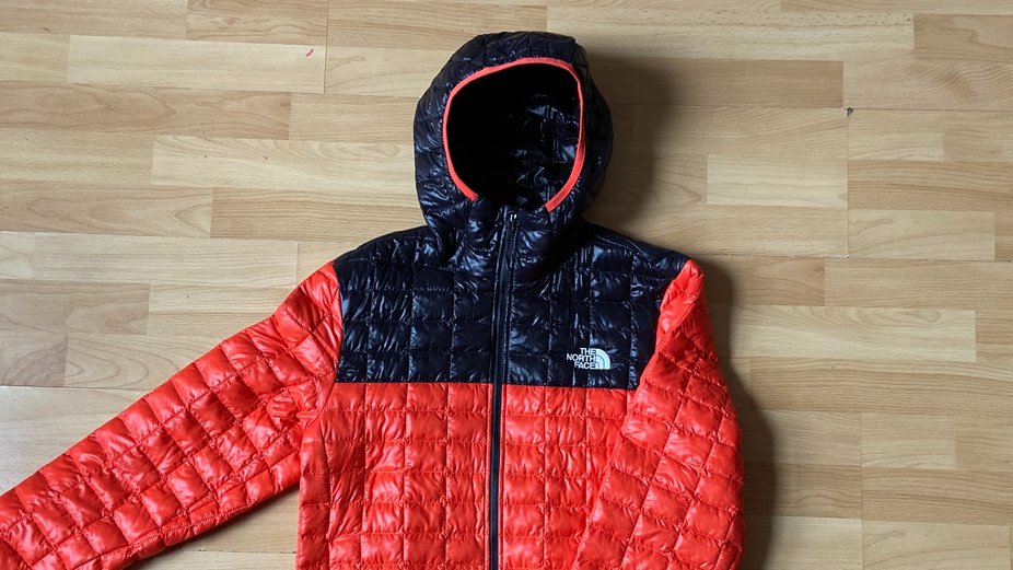 Red and black north face thermoball jacket hot sale